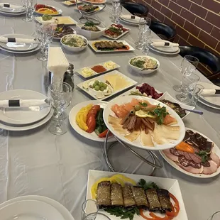 a long table with plates of food