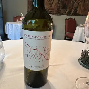 Our wine selection with some decor and seating arrangements in the background.