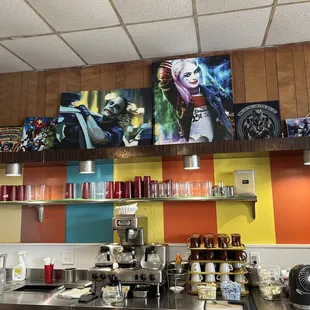 a variety of art on the wall
