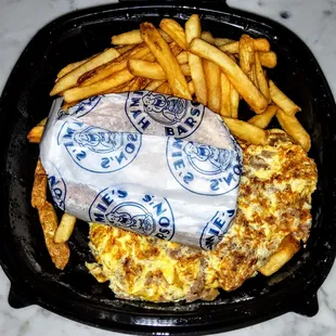 Philly Cheesesteak Omelette: Thin sliced steak with American cheese, fried onions, diced and mixed with eggs. &amp; 13.95