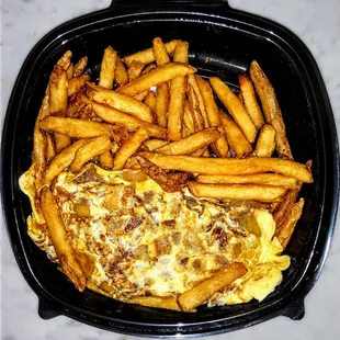 Philly Cheesesteak Omelette: Thin sliced steak with American cheese, fried onions, diced and mixed with eggs. &amp; 13.95