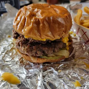#3 Oklahoma Onion Burger mustard pickles grilled onions and American cheese. I added an extra patty because I didn&apos;t know how big they were.