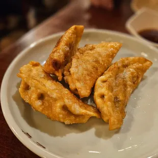 a plate of fried dumplings