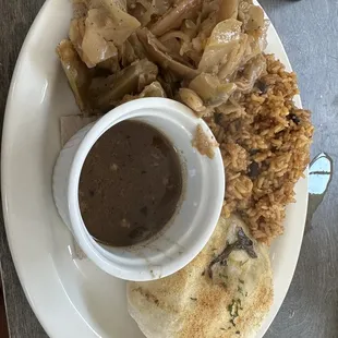 The oxtail is inside the white bun thing! Comes with red beans and rice.