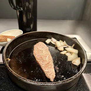 The last cut of the first round is the only marinated cut of the night. Served with grilled onions