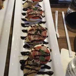 a long rectangular plate of appetizers