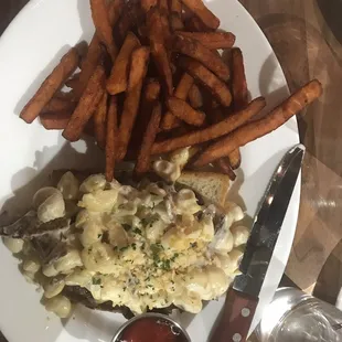 Macaroni and cheese burger with sweet potato fries. Delicious!