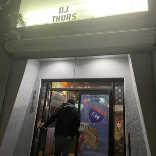 a man entering a bar