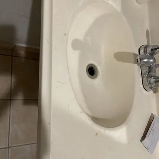 Nasty ass sink with hair and shit all over it