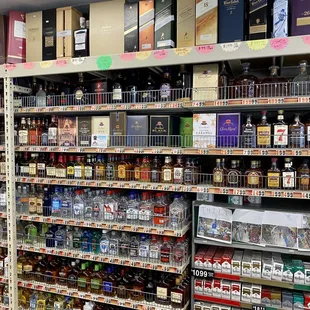 a shelf of liquor in a liquor store