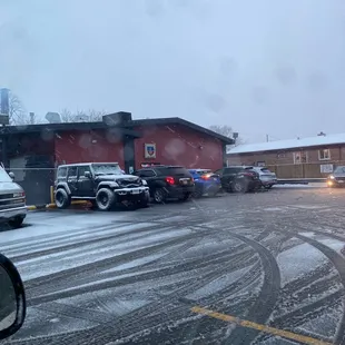 a snow covered parking lot