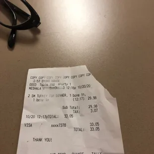 a receipt and glasses