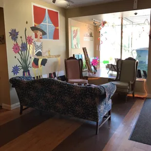 Cozy seating and vibrant wall art make this space great!