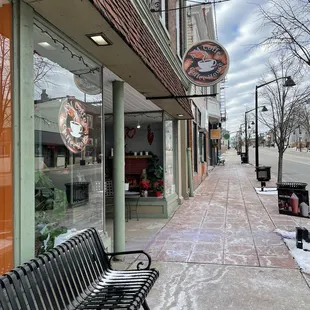 a bench on the sidewalk