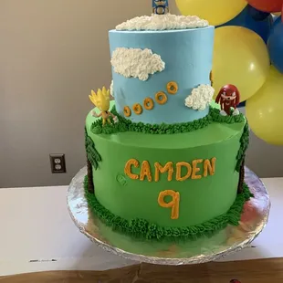 Top tier carrot cake with walnut filling  Bottom tier vanilla with strawberries and cream.