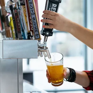  a person pouring a beer