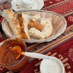 a plate of bread and dipping sauce