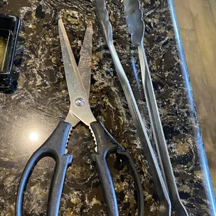The utensils are cheap quality as well. The scissors are not sharp and the tongs barely work.