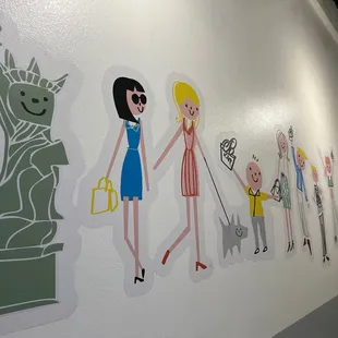 Wall art in the hallway to the bathroom
