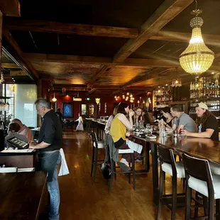  people sitting at a bar