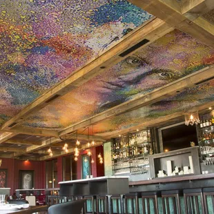 Artwork on the ceiling above the bar