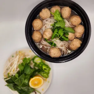 a bowl of soup and a plate of meatballs