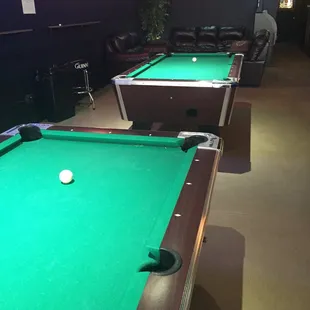 Dos pool tables w/ lounge area