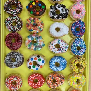 a tray of assorted donuts
