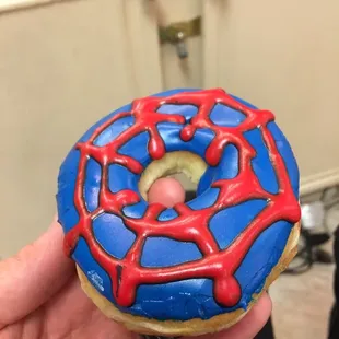 They do designs here! This is blueberry flavored. I refer to it as a Spider Man 2099 donut.