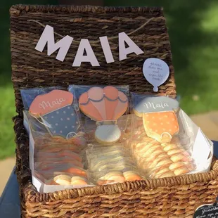 Custom-made onesie and hot air balloon cookies for a baby shower