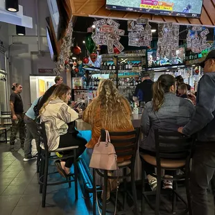 people sitting at the bar
