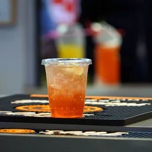 a drink in a plastic cup