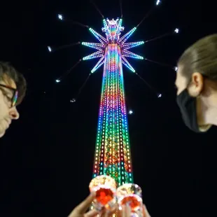 two people looking at a christmas tree