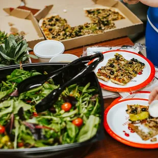 a table full of pizzas