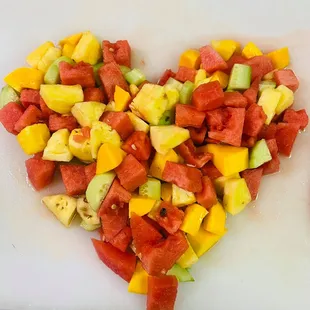 a heart made out of fruit