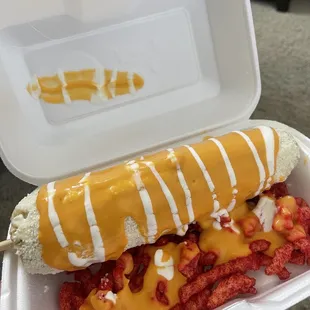 Elote Entero With hotcheetos, queso nacho, crema