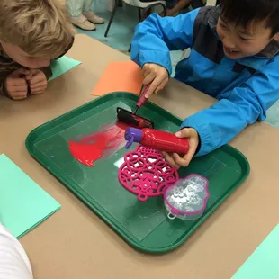 Making prints at I heart art.