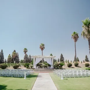 Wedding chairs, drapery and floral garlands