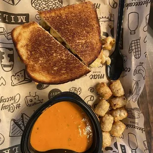 a grilled cheese sandwich and a bowl of soup