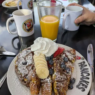 Nutella French toast with bananas, berries and whipped cream