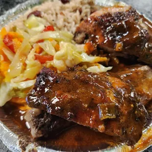Jerk chicken, cabbage, and rice