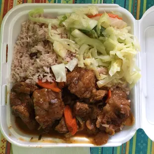 Medium, oxtail with beans and rice and steamed cabbage.