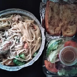 a bowl of pasta and a salad
