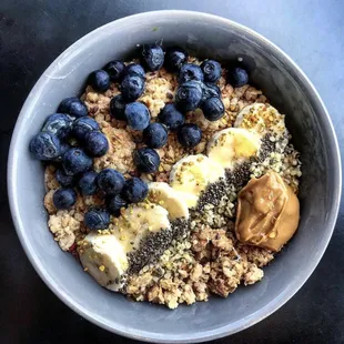 a bowl of oatmeal with blueberries and bananas