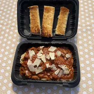 Our signature spaghetti w/ garlic bread.