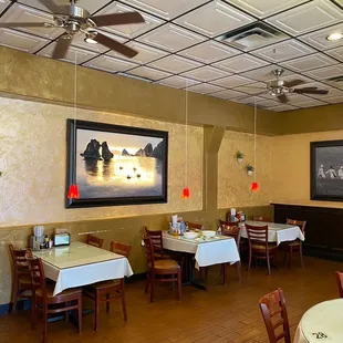 a dining room with tables and chairs