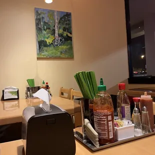 a table with a tray of condiments