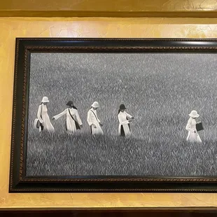 a group of people walking through a field