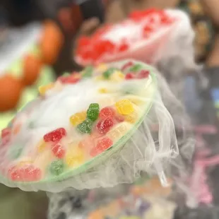 a woman taking a picture of a dessert
