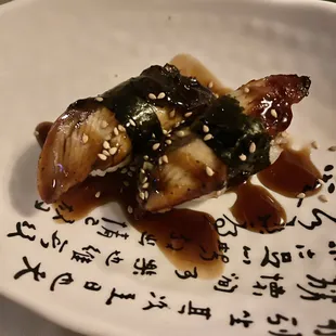 a piece of sushi on a plate